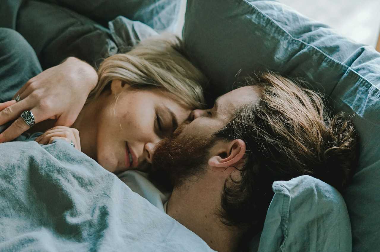 couple in bed having good night sweet dreams 