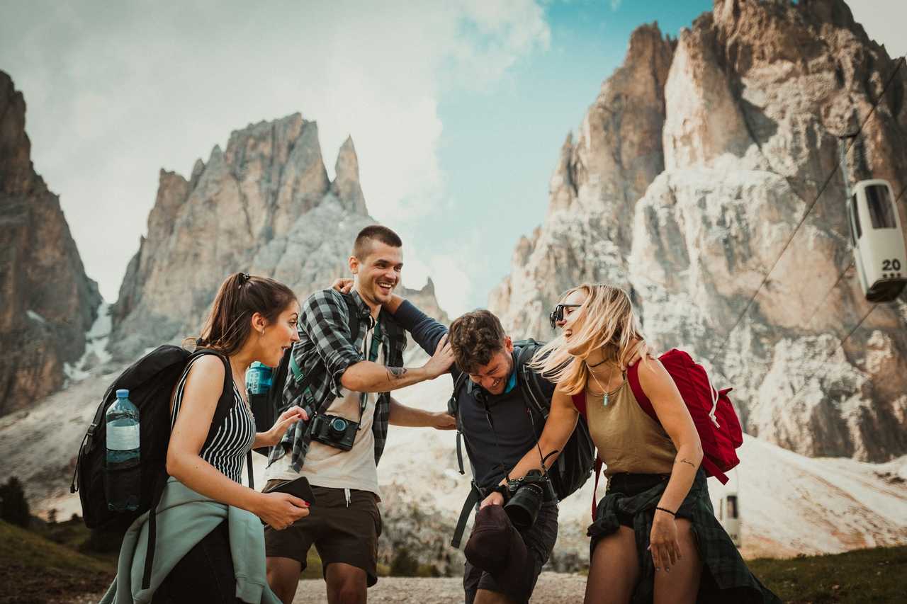 friends hiking and laughing together saying positive short messages for each other
