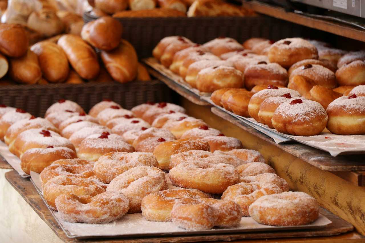 several sufganiot displayed in a baker shop for hanukkah 