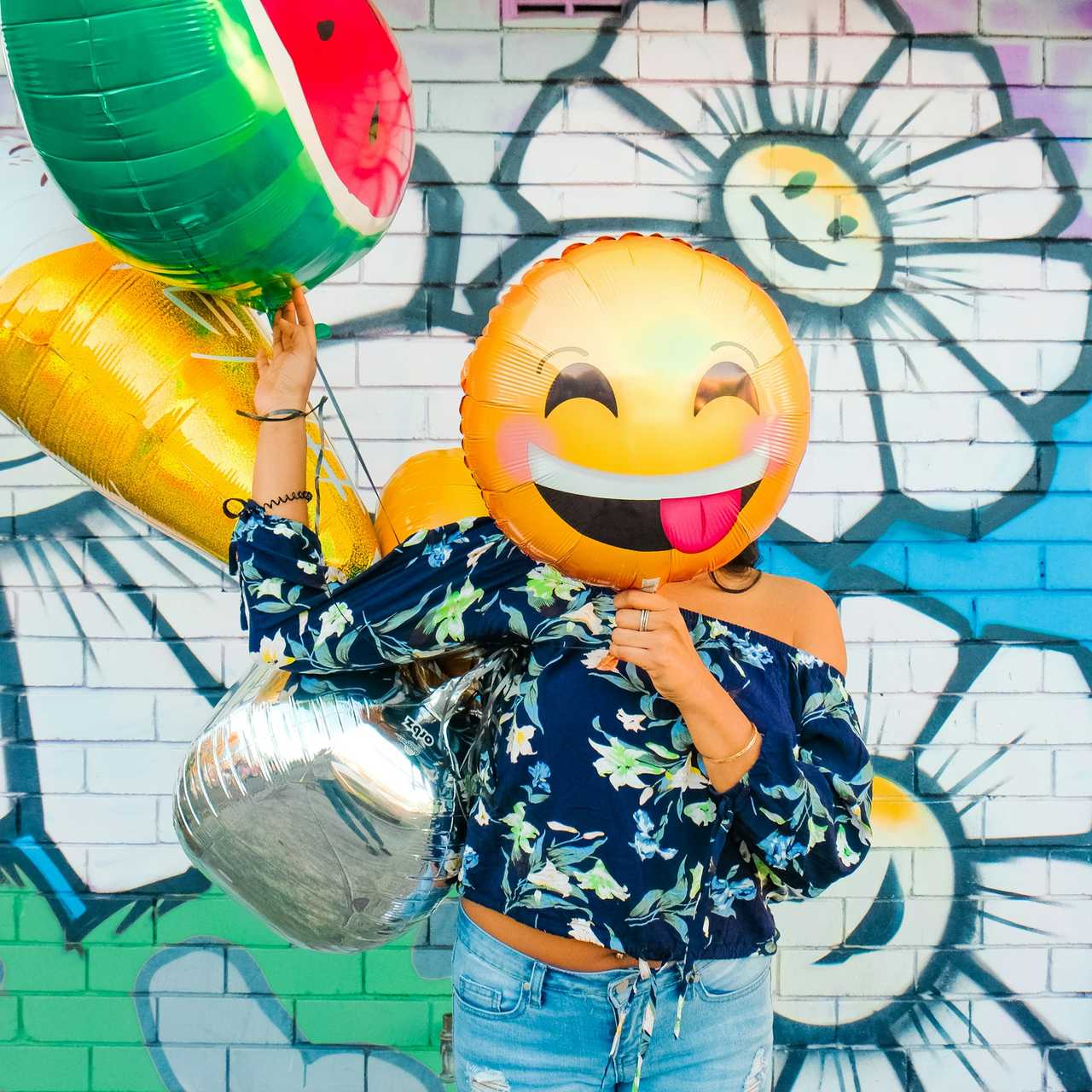 woman with smile ballon by a wall with graffiti sending ai messages generated by the everything else tool