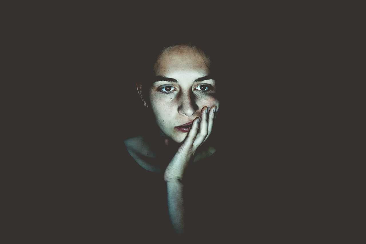 girl bored in the dark
