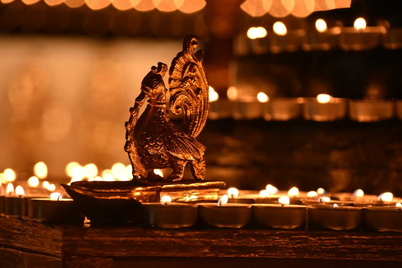 diwali candles burning in the dark to celebrate and send happy diwali wishes