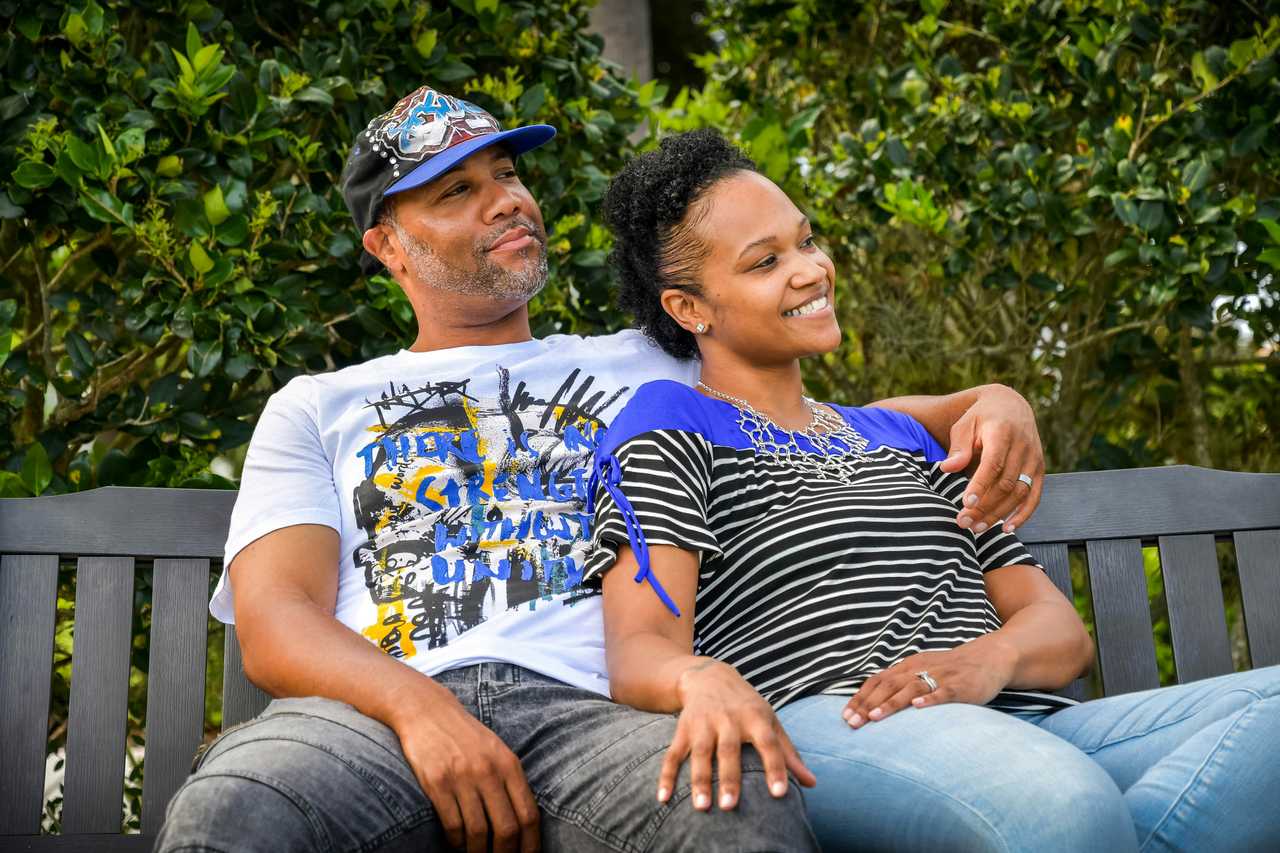 couple of husband and wife seating in a park saying i love you wife messages