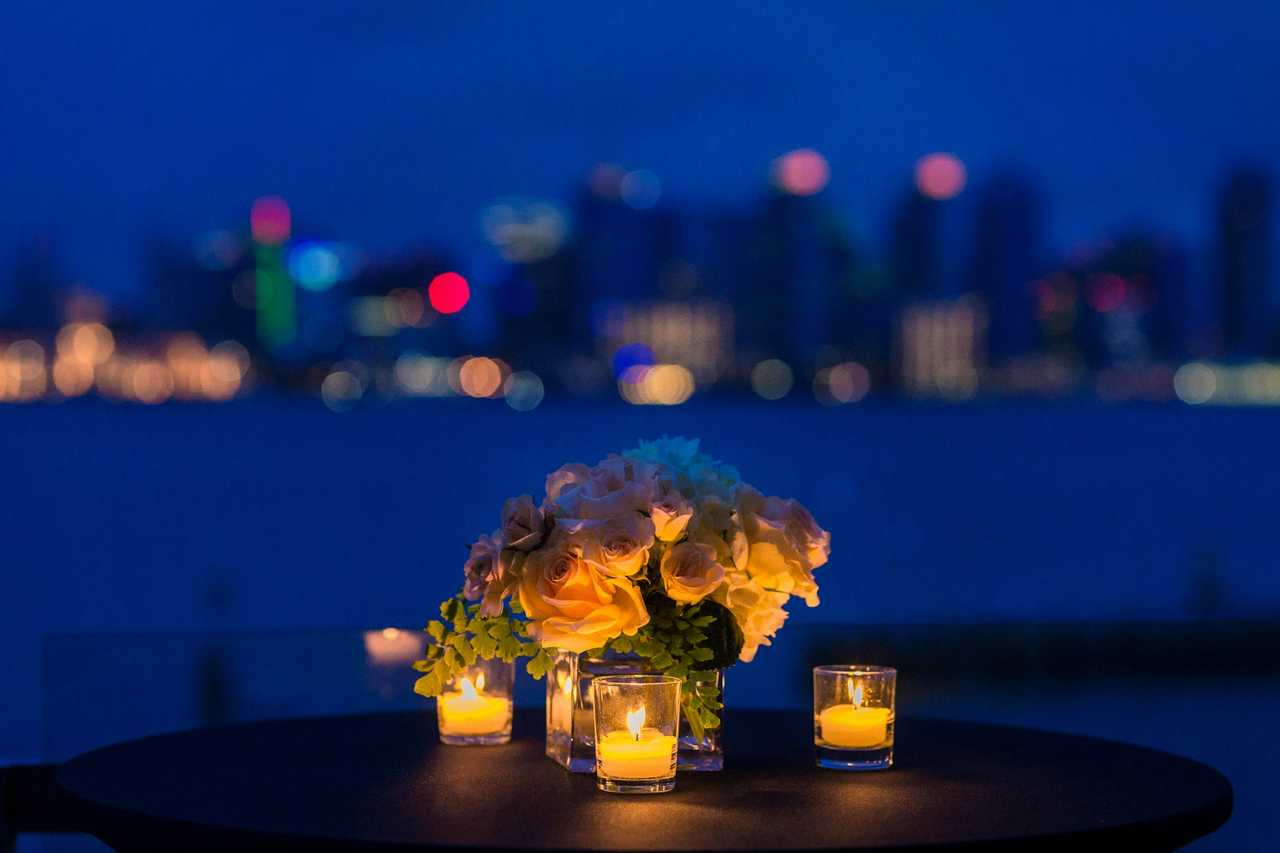 flower ornament for a table in valentine's day at night with city skyline on the background