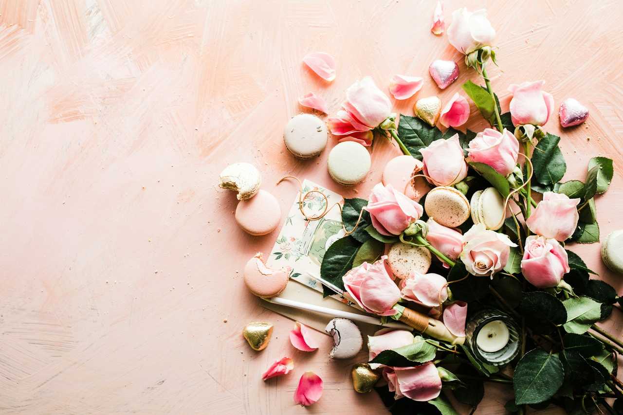 flowers laid out in a rose background