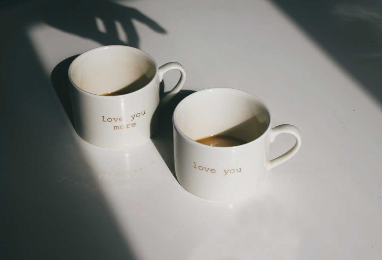 two almost empty cups of coffee under the sunlight in the morning for good morning wishes