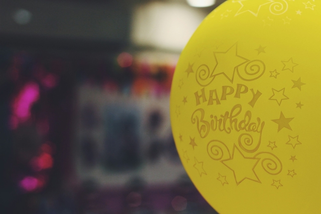 happy birthday message for brother on a yellow balloon
