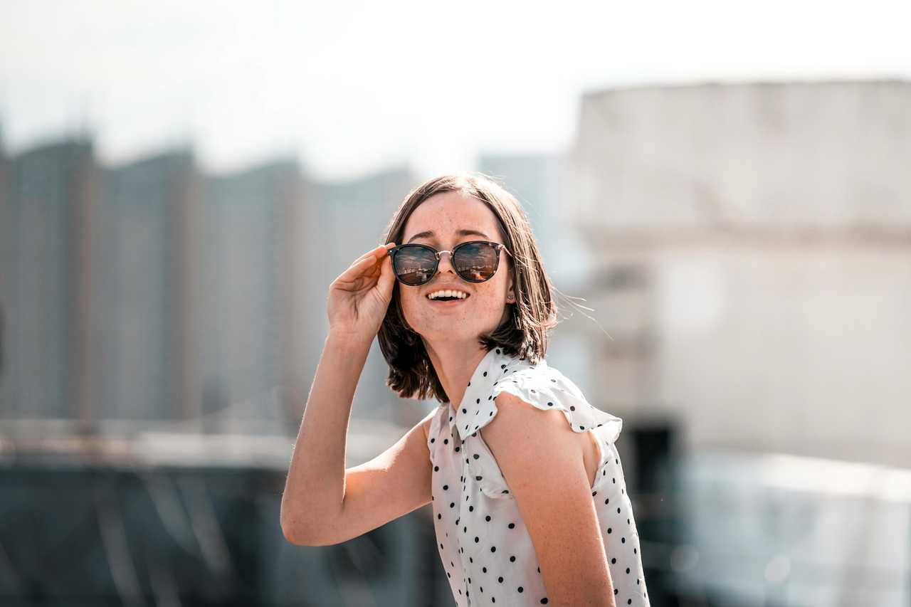 woman looking through her glasses getting love messages