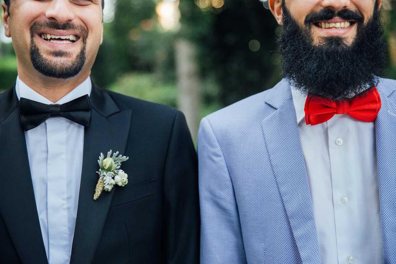 two husbands by each other wearing formal clothes saying love messages for him