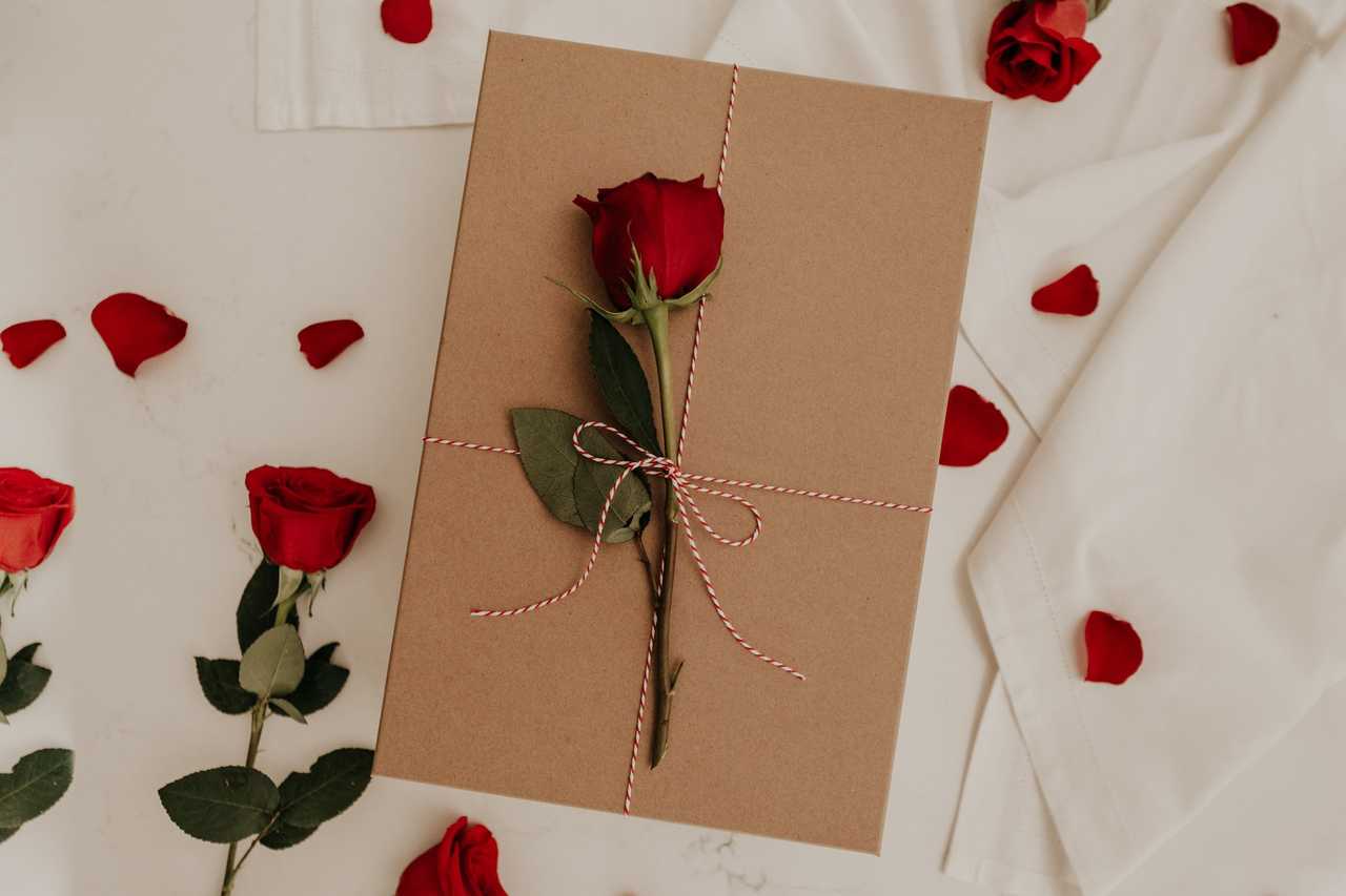 rose over a wrapped letter with ai generated love messages