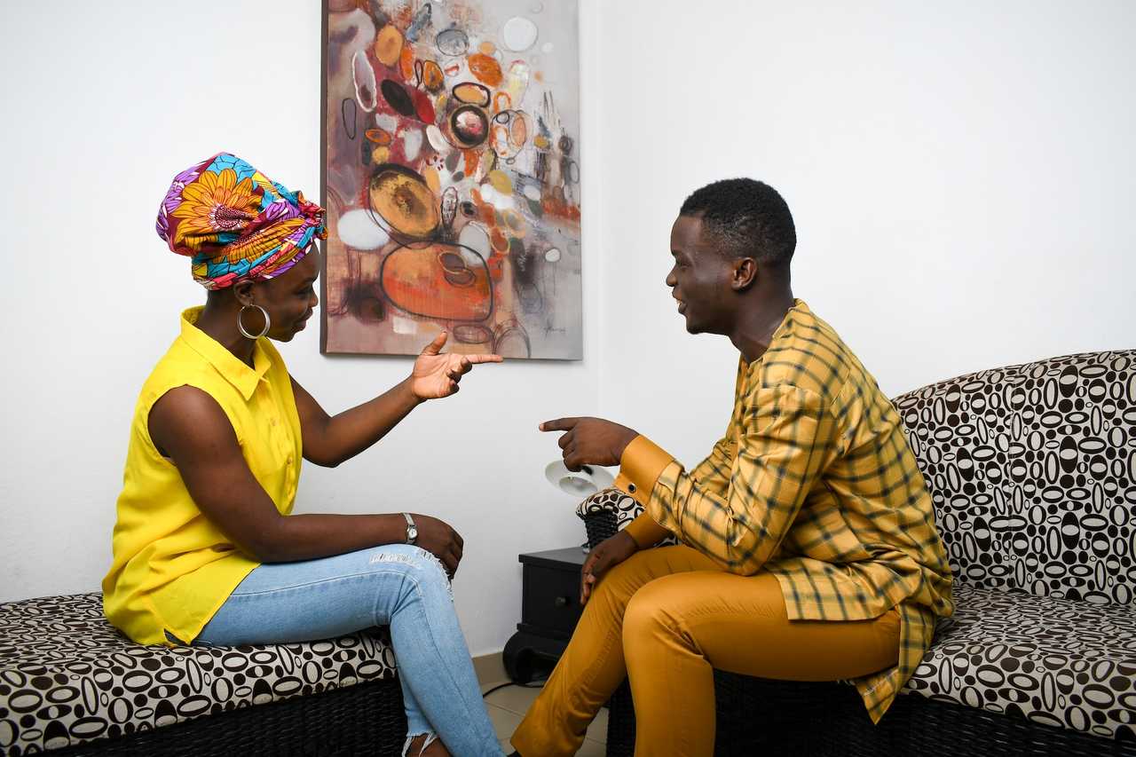 couple discussing and breaking up sending break up messages
