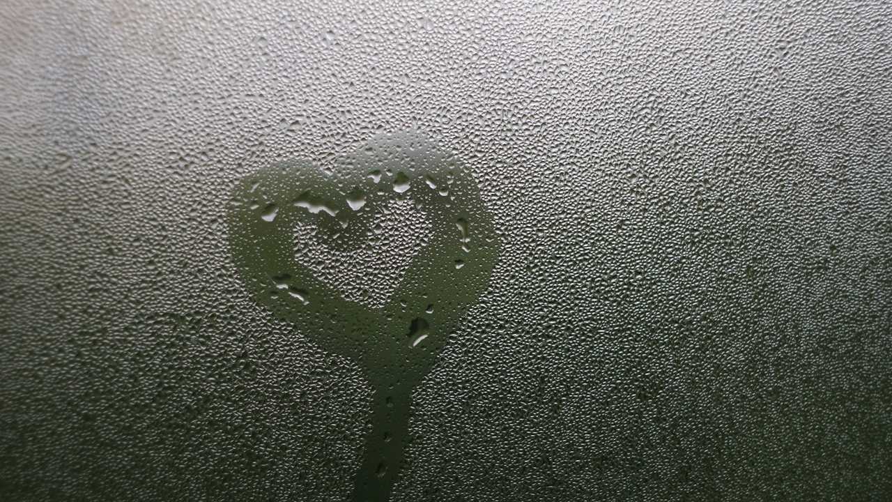 heart shape drawn in a wet glass for i miss you so much messages