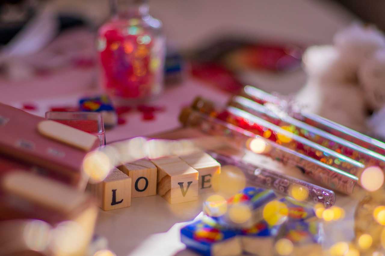 love words and other craft supplies in a table for a love confession message