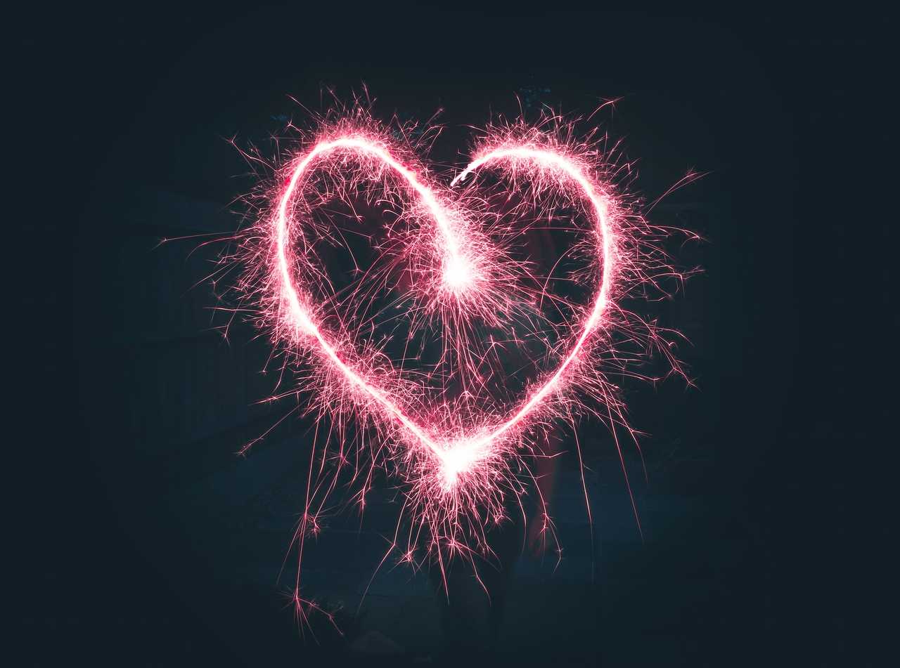 pink heart-shaped firework on dark sky for valentine's day quotes for her
