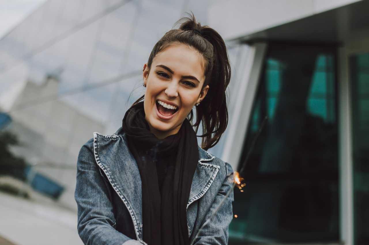 woman with pony tail smiling for getting love messages for her