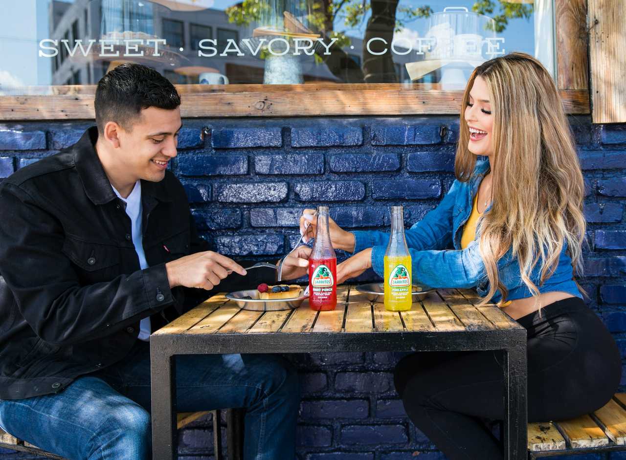 couple in a first date sharing Mexican food and talking about their favorite things