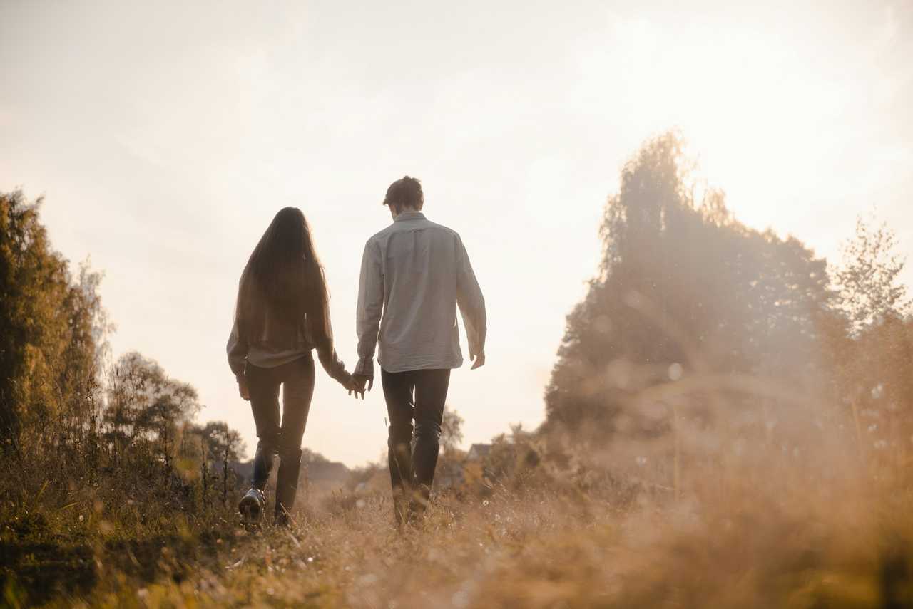 boyfriend and girlfriend hiking on Valentine's Day in the morning