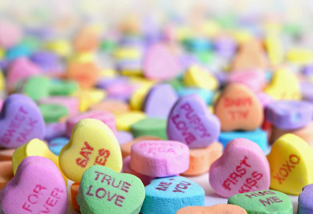 heart-shaped candy with love and valentine wishes printed one