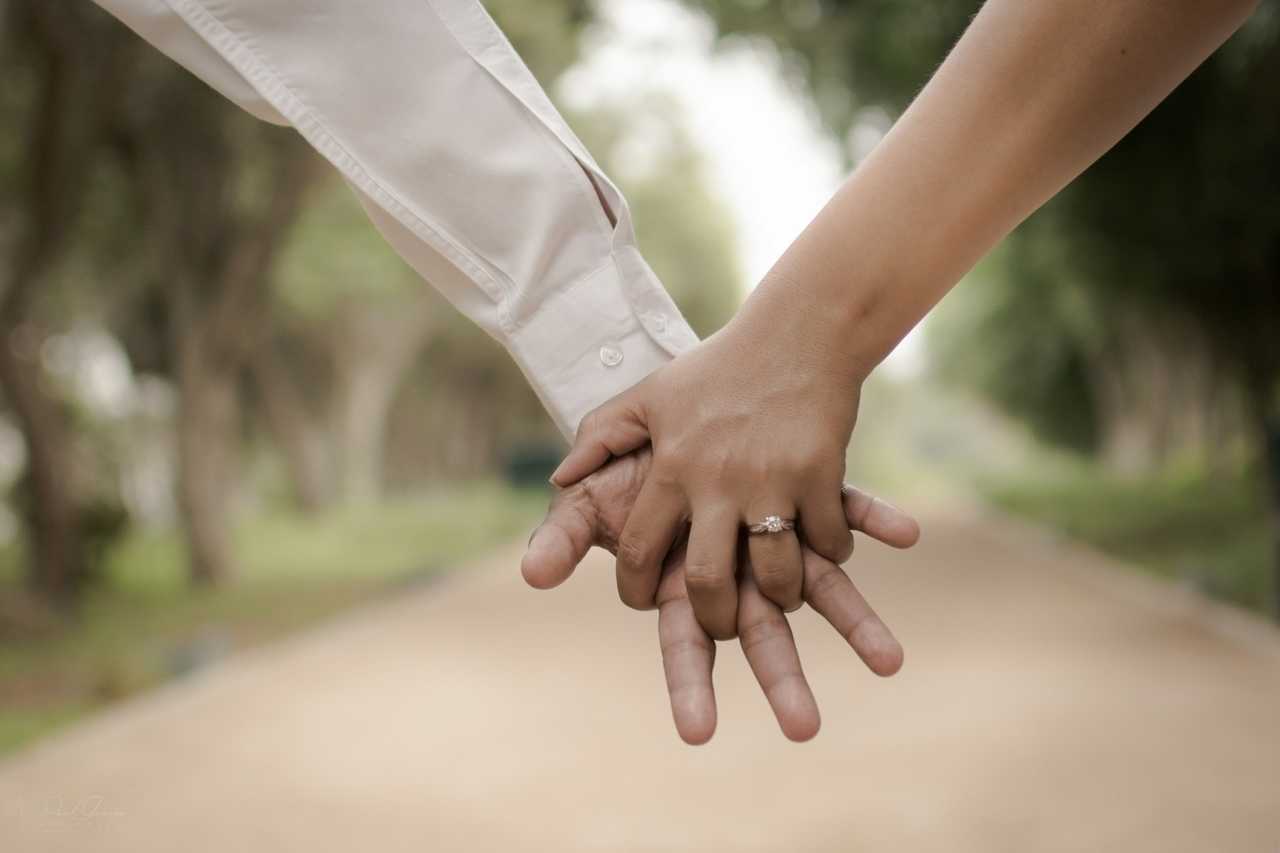 hands tied on valentine's day in a park