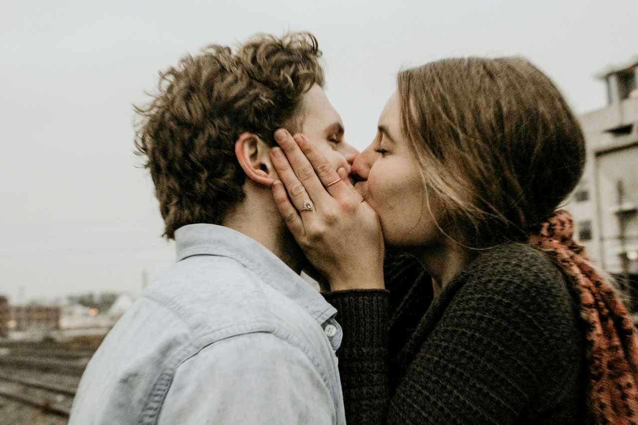 couple kissing for the first time ready to say something after the kiss