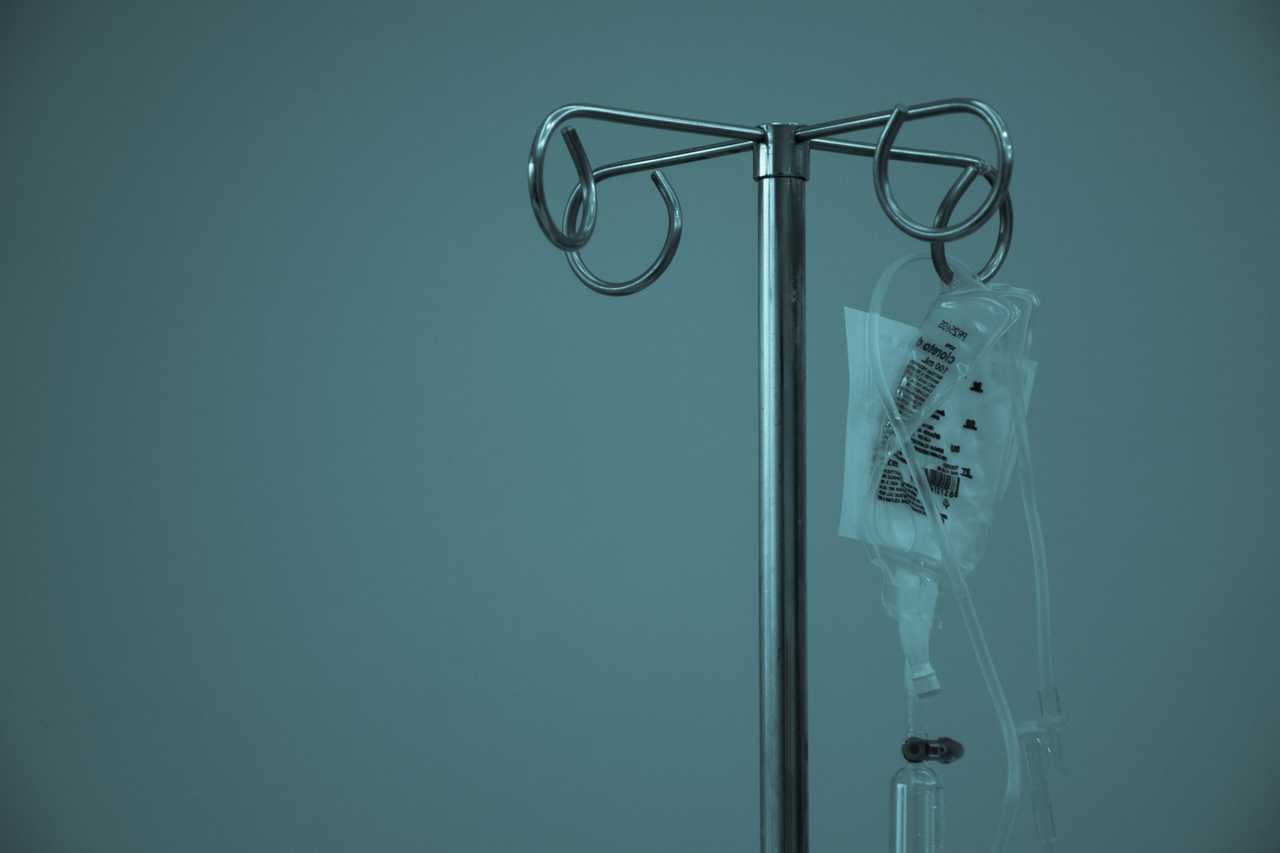 bag of medicine for cancer patient in detail on a dark room