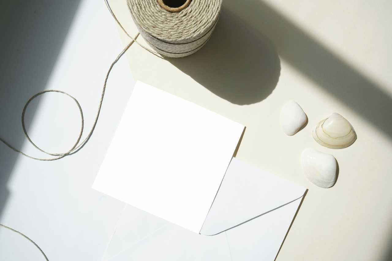 blank card and craft supplies for a birthday invitation message