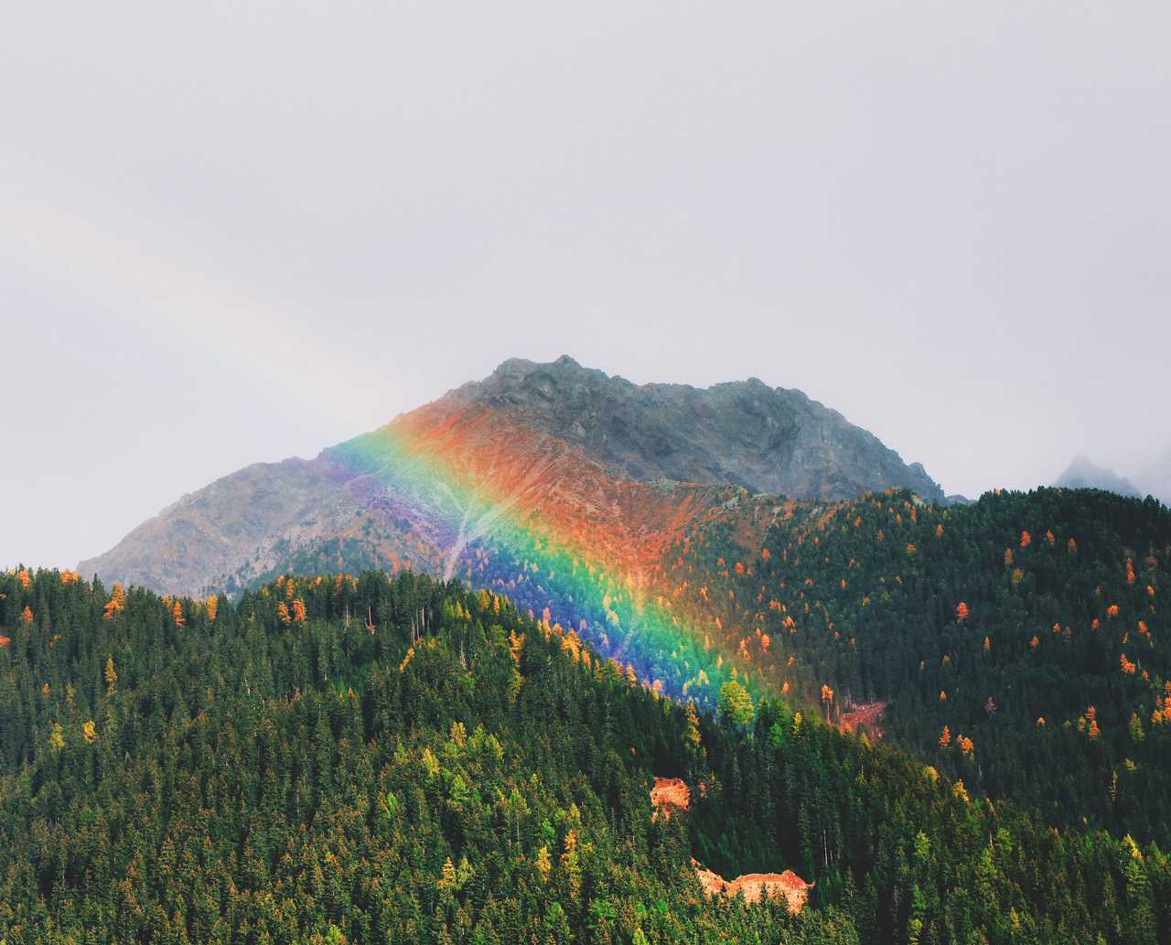 rainbow over mountains on a cloudy valentine's day