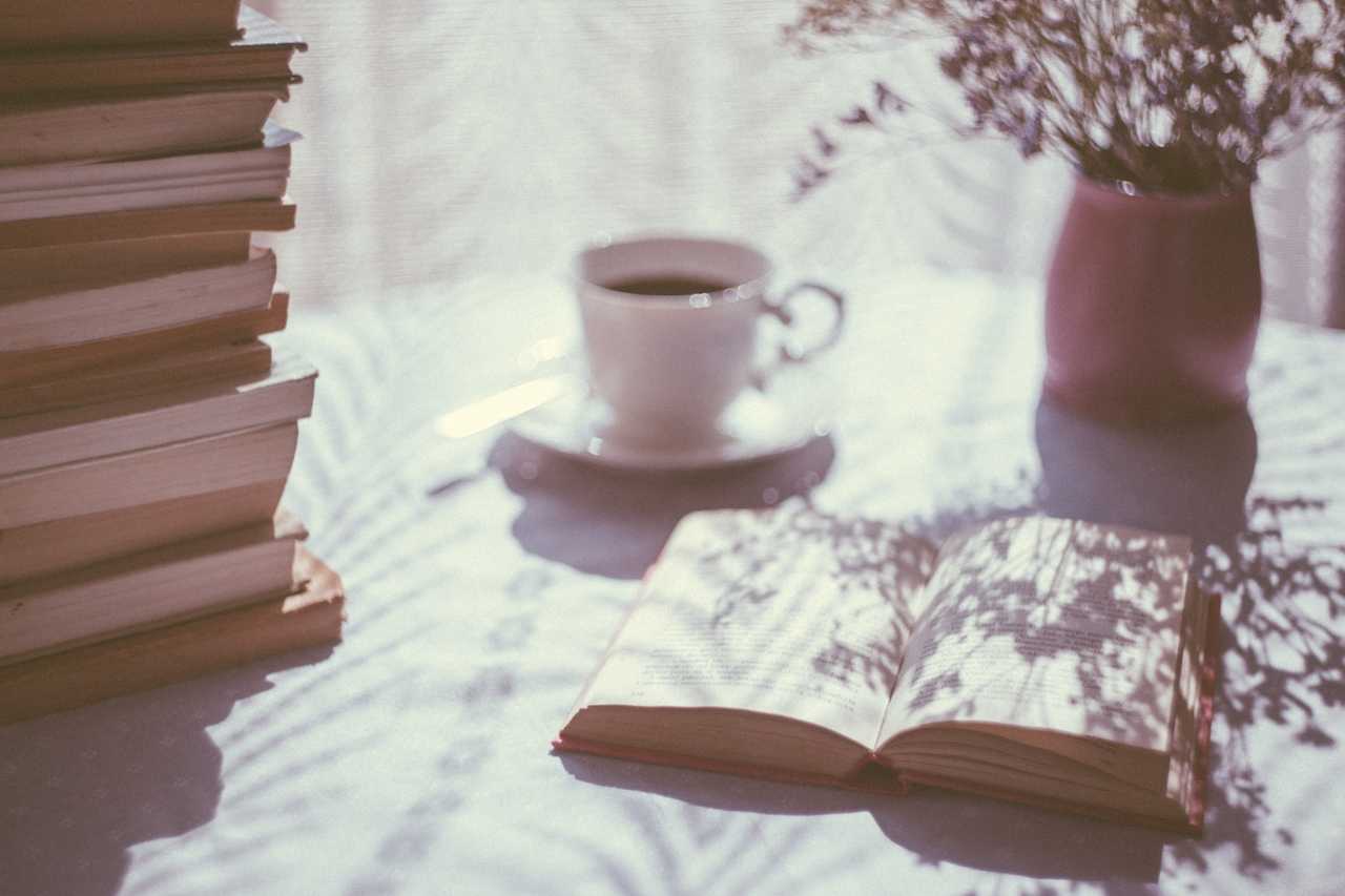 table with coffee and books showing good morning wife messages