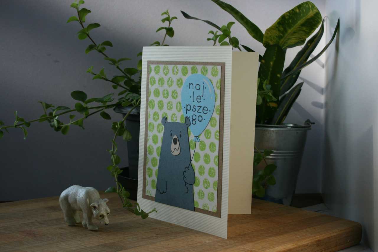 greeting card by a plant and a bear miniature