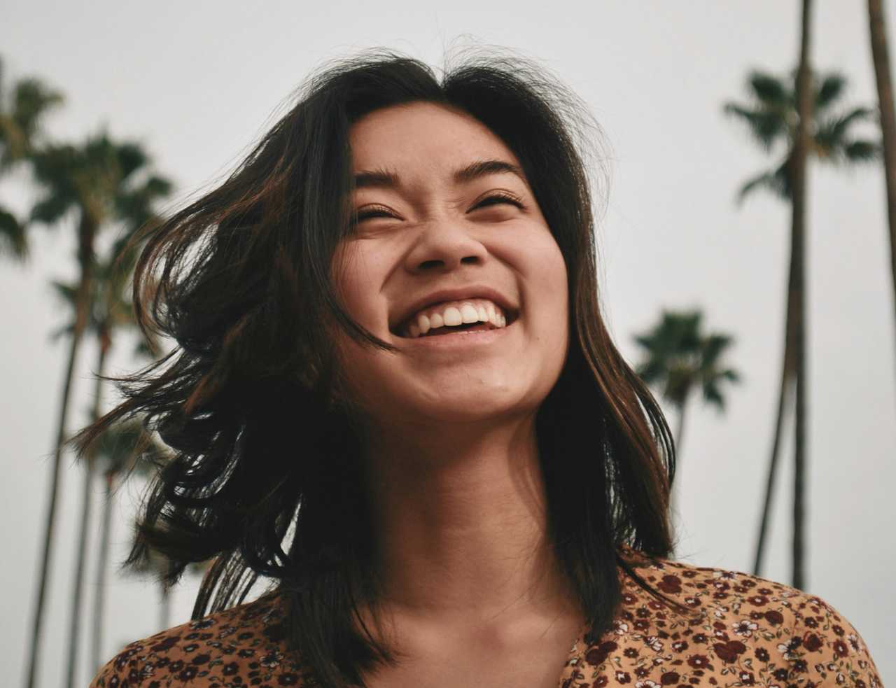 woman laughing getting good morning messages for her