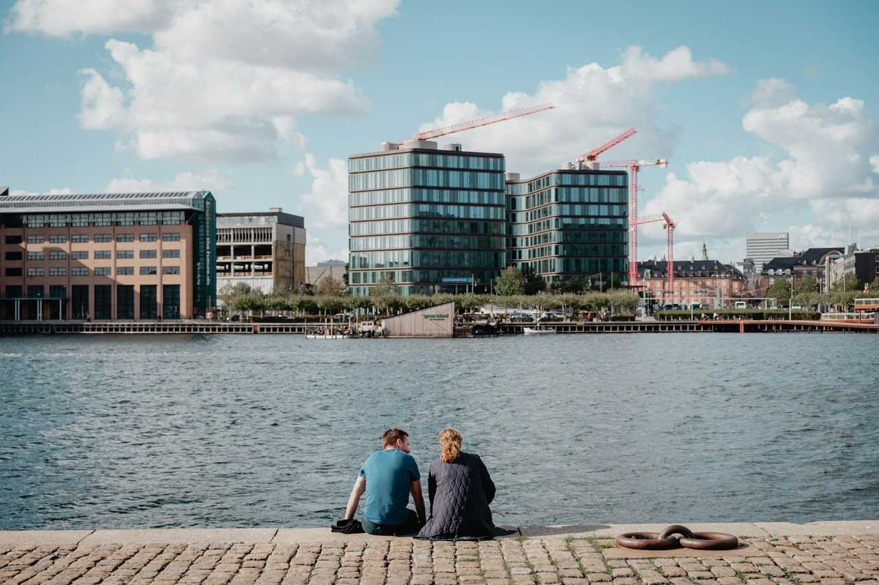 couple having a first date by a river in the city no kiss rule
