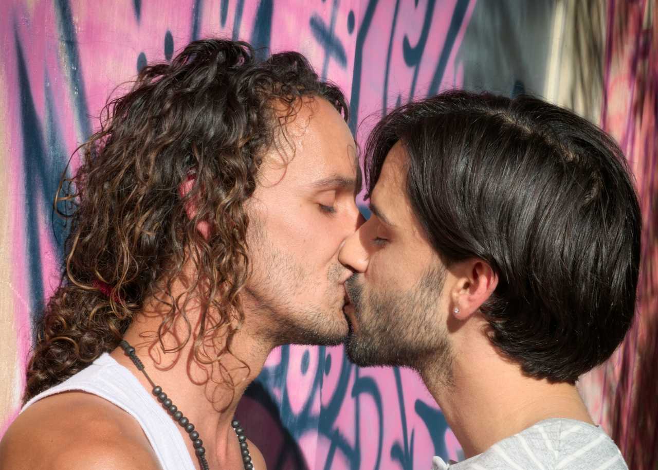 two men kissing for the first time after which they'll say something cute to each other