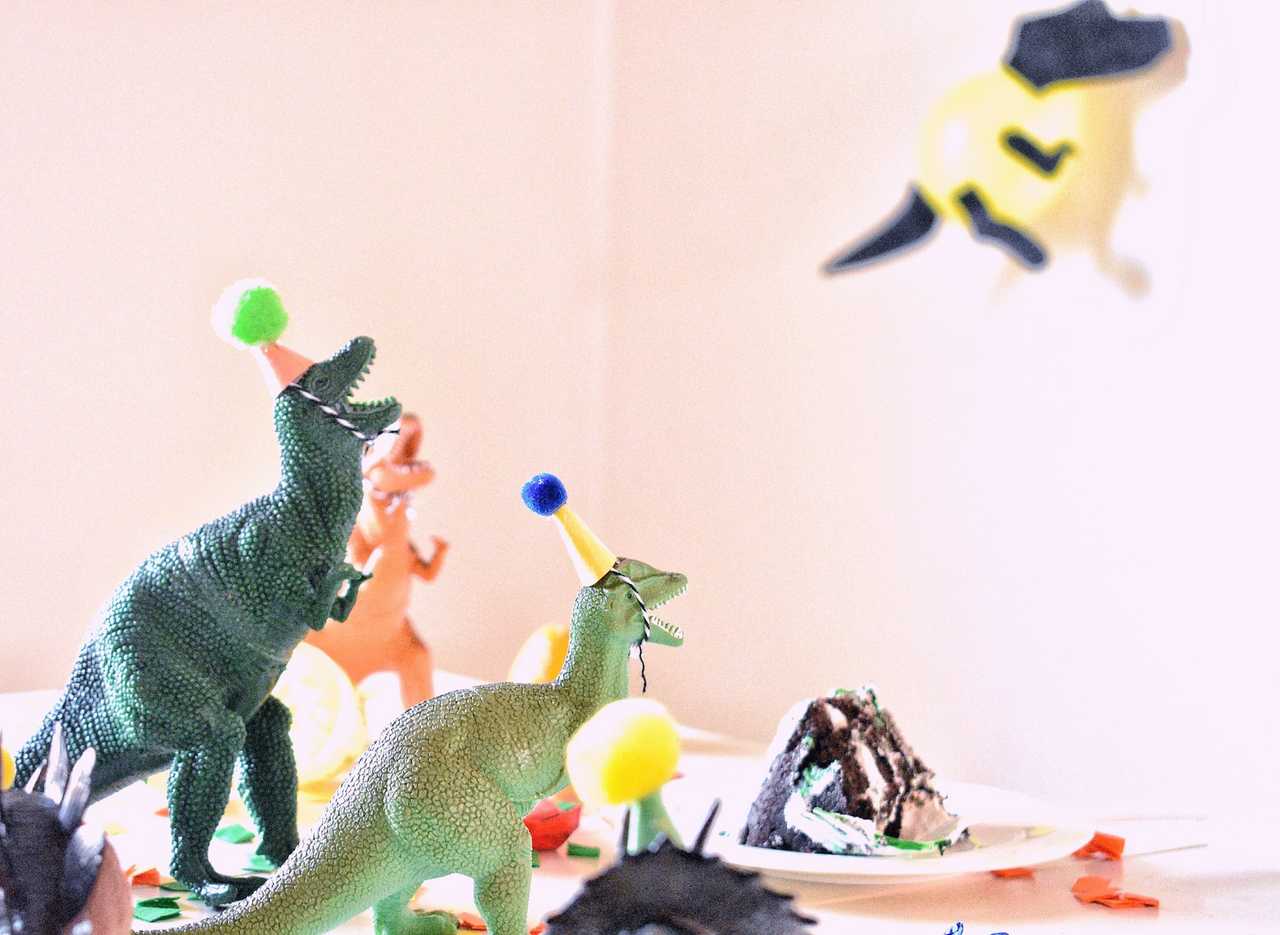 plastic dinosaurs for a themed kid birthday party and invitation